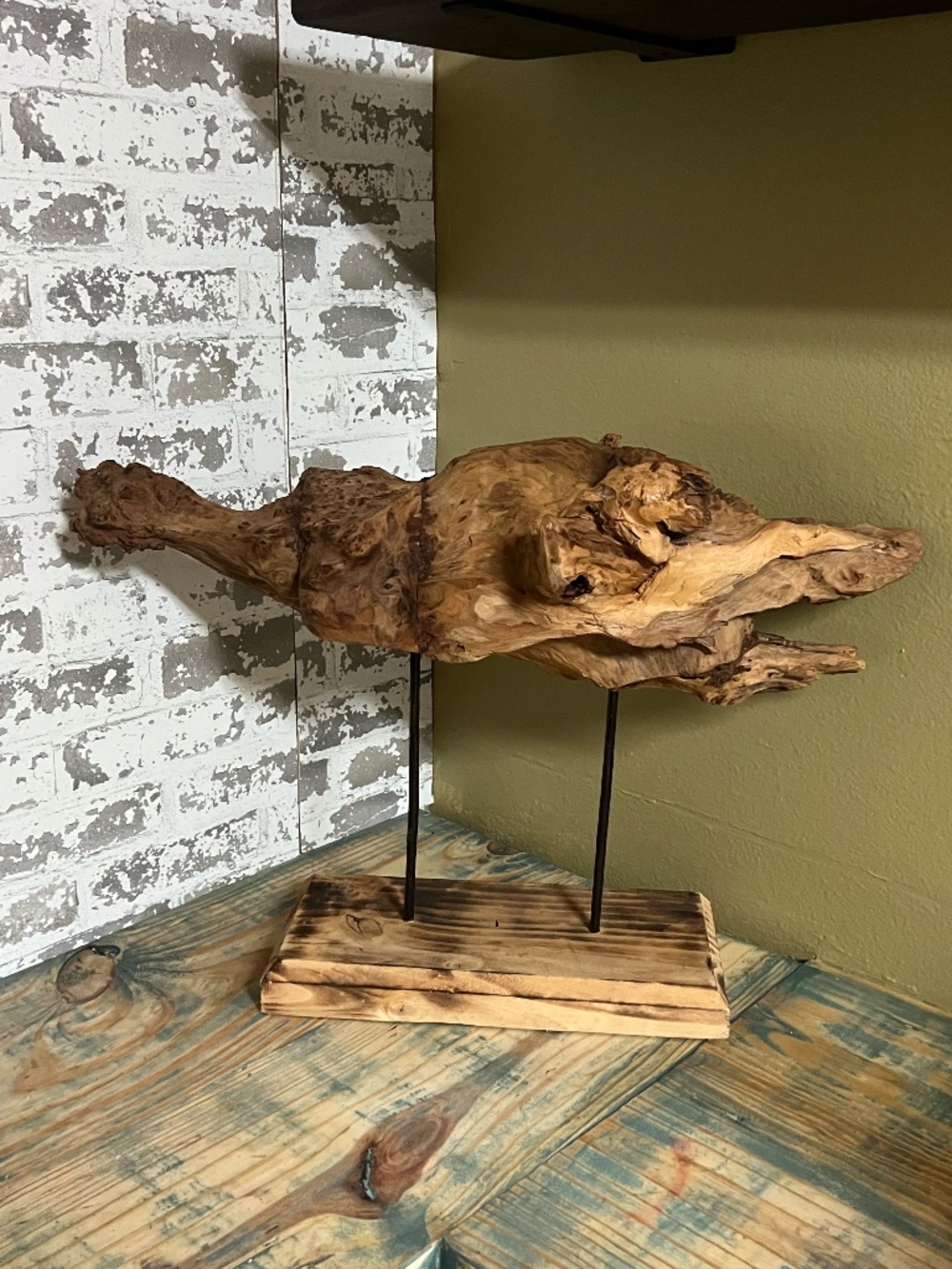 Natural weathered wood  teak root rustic tabletop art piece supported by metal